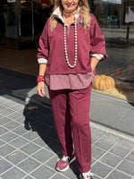 Chic Two-piece Set Featuring A Half-zip Sweatshirt With Mixed Plaid Paneling And Matching Pants.