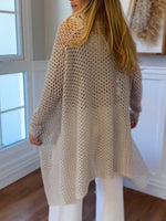 Chic Long-line Knit Sweater With A Stacked Collar And Cut-out Detailing.